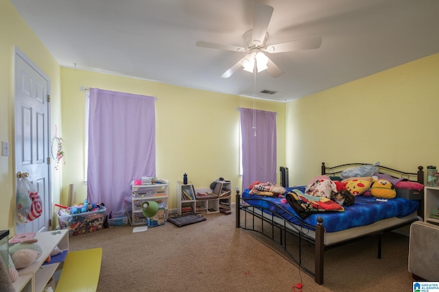 carpeted bedroom featuring ceiling fan