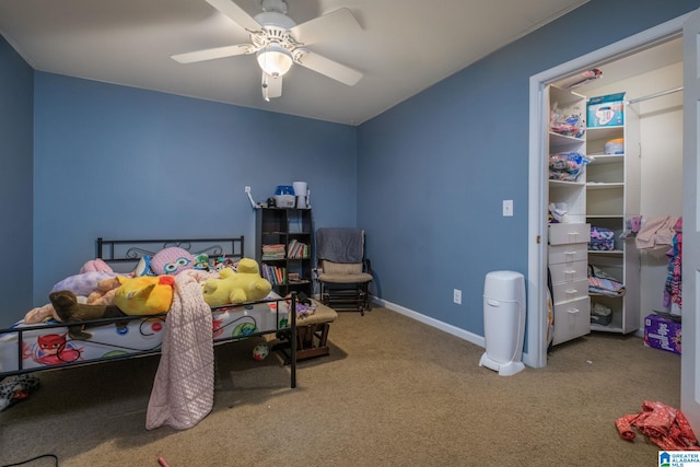 bedroom featuring ceiling fan and carpet