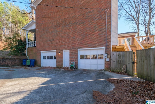 view of side of home featuring a garage