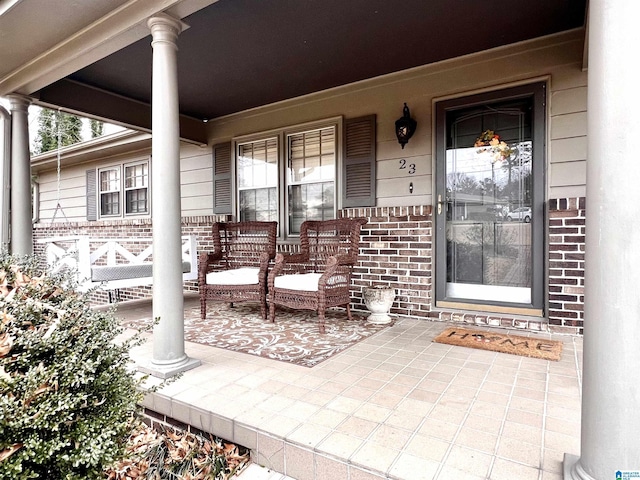 doorway to property featuring a porch