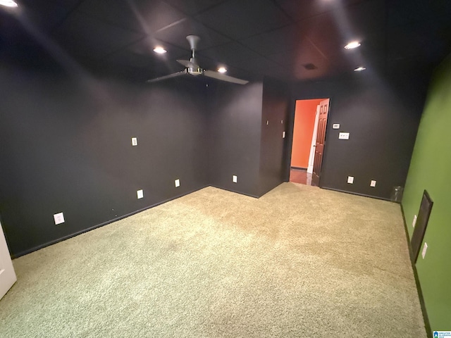 interior space with carpet floors and ceiling fan