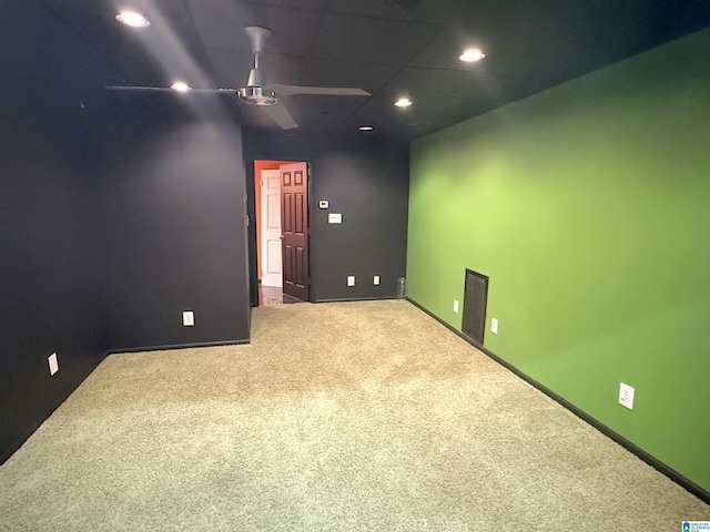 empty room with carpet floors and ceiling fan