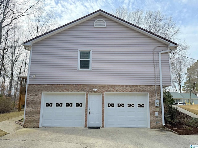 view of side of property with a garage