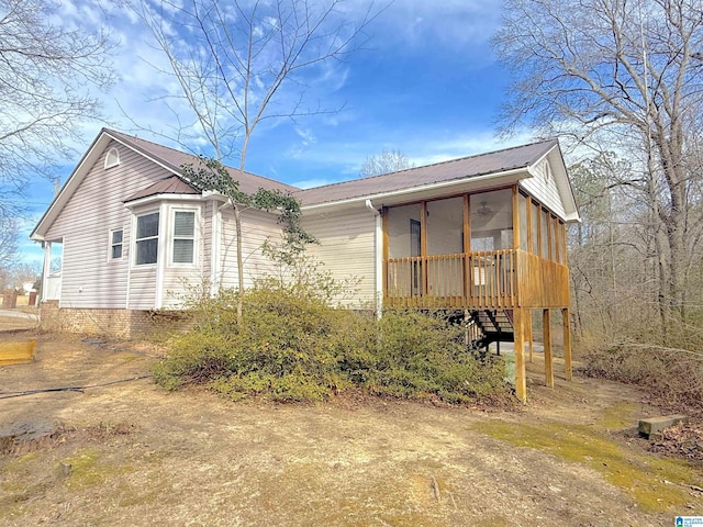 view of front of house featuring a sunroom