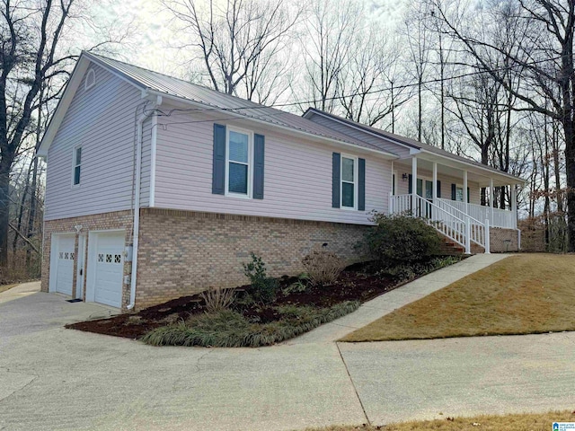 view of front of home featuring a garage and a porch