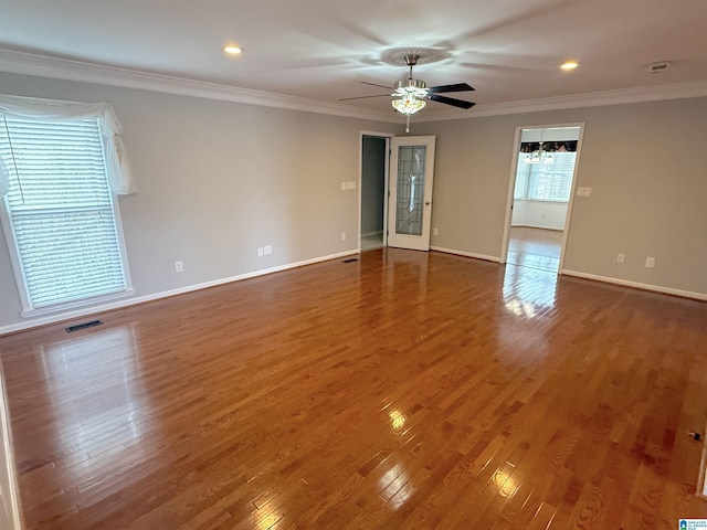 spare room featuring ceiling fan, crown molding, and dark hardwood / wood-style floors