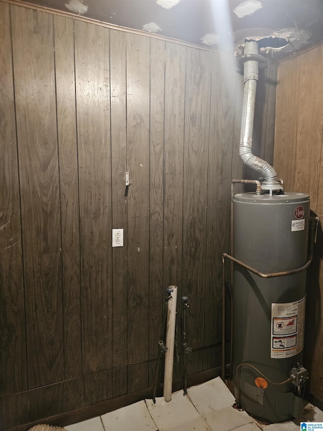 utility room with gas water heater