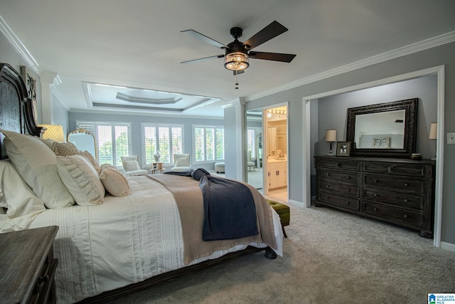 carpeted bedroom with connected bathroom, ceiling fan, and ornamental molding