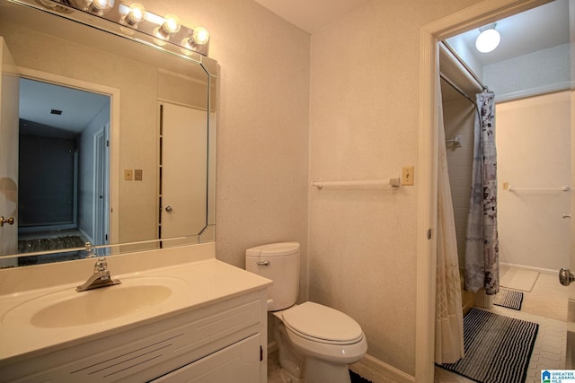 bathroom featuring curtained shower, toilet, and vanity