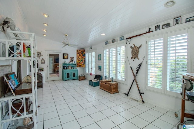 living area featuring ceiling fan, wooden ceiling, lofted ceiling, and light tile patterned flooring