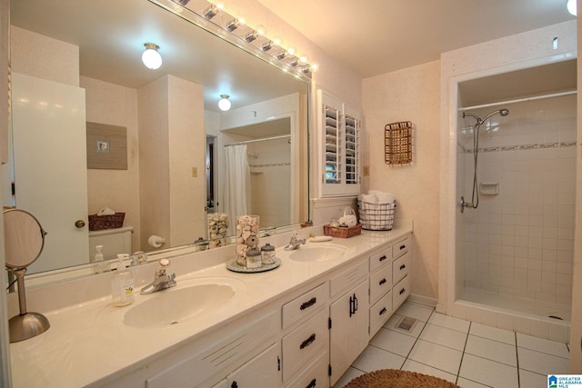 bathroom with vanity, toilet, tile patterned flooring, and a shower with curtain