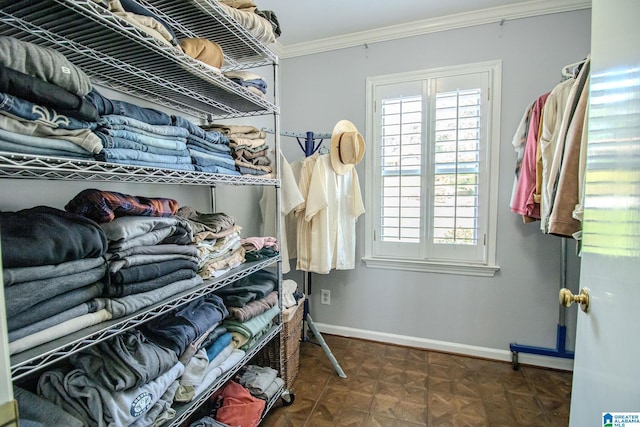 spacious closet featuring dark parquet flooring