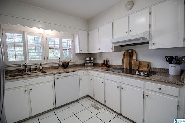 kitchen featuring white dishwasher, black electric stovetop, white cabinetry, sink, and dark stone counters