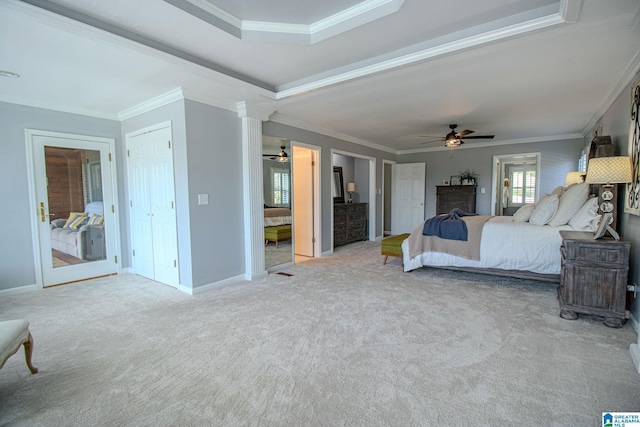 bedroom with crown molding, light colored carpet, ceiling fan, and a raised ceiling