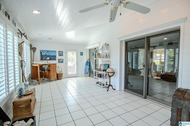 sunroom featuring lofted ceiling and wood ceiling