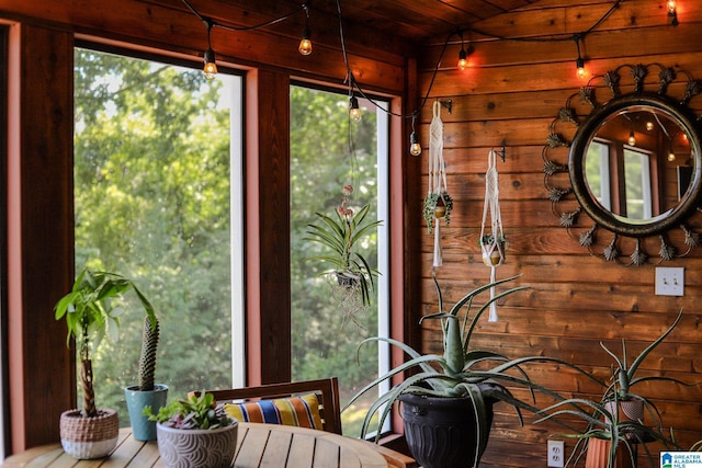 unfurnished sunroom with wooden ceiling