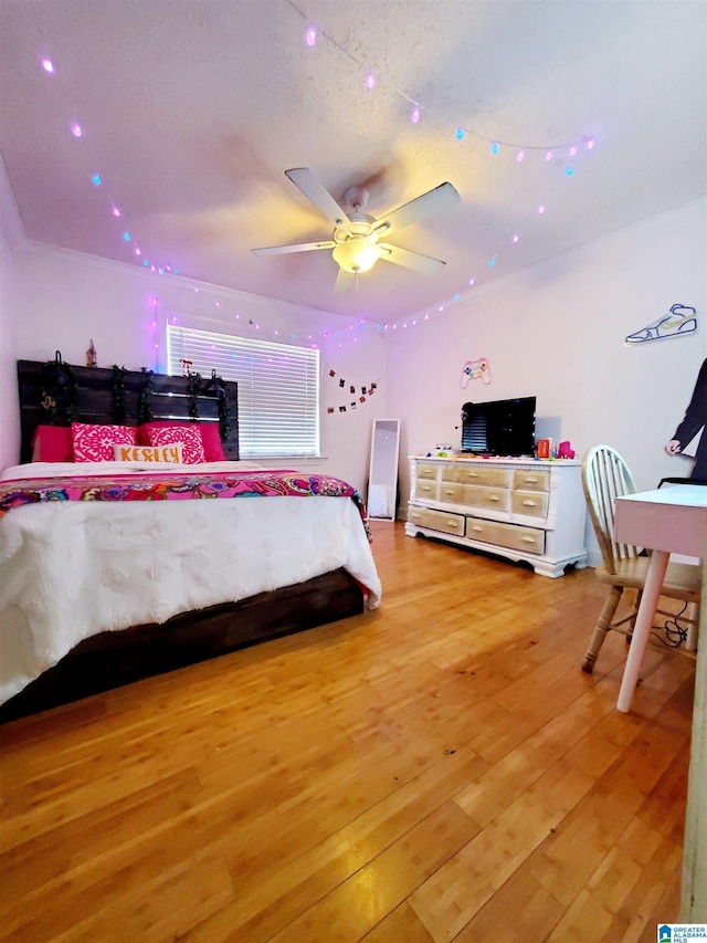 bedroom with wood-type flooring and ceiling fan