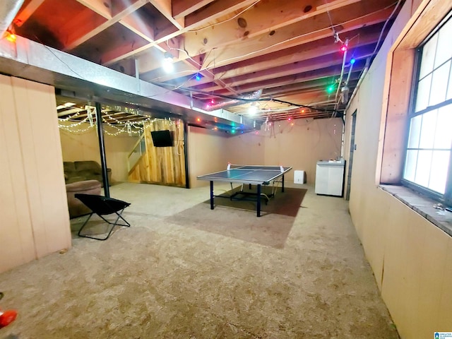 recreation room featuring washer / dryer and carpet floors