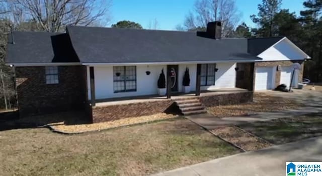 view of front of house with a garage and covered porch