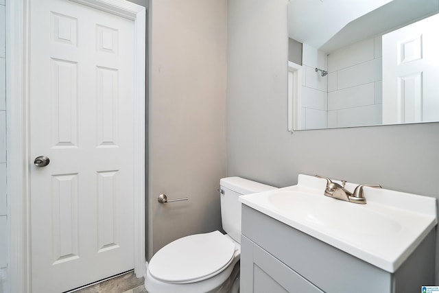 bathroom with toilet and vanity