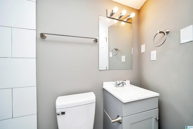 bathroom featuring toilet and vanity