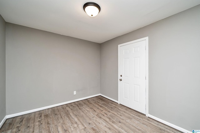 unfurnished room with light hardwood / wood-style flooring