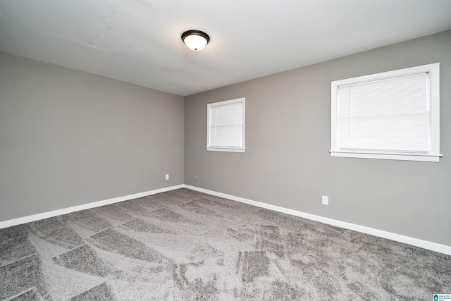 unfurnished room with carpet floors