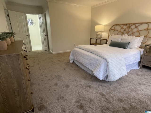 bedroom featuring crown molding and carpet