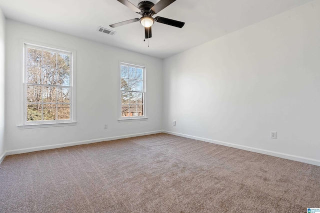 empty room featuring carpet and ceiling fan