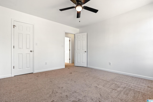 empty room featuring ceiling fan and carpet flooring