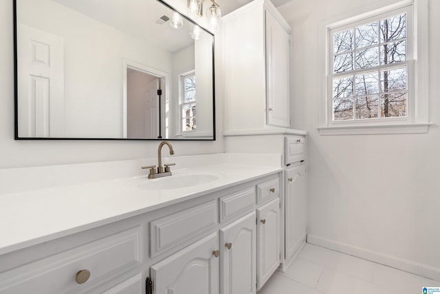 bathroom with tile patterned flooring and vanity