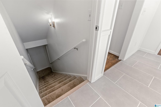 stairs with tile patterned flooring