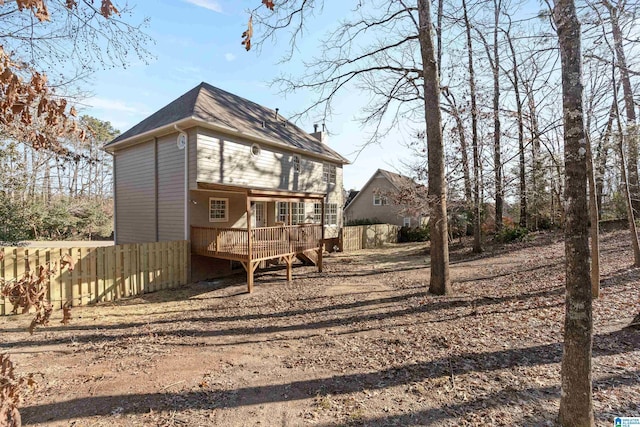 rear view of house with a wooden deck