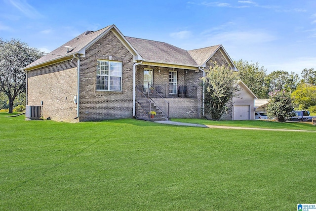 ranch-style house with a garage, a front yard, and central AC