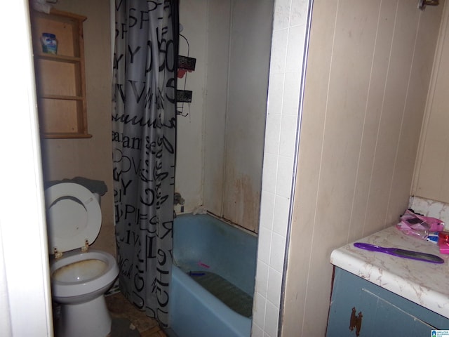 bathroom with wooden walls, toilet, and shower / tub combo with curtain