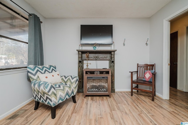 living area with light hardwood / wood-style flooring