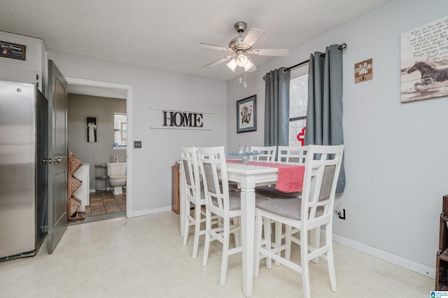 dining space with a wealth of natural light and ceiling fan