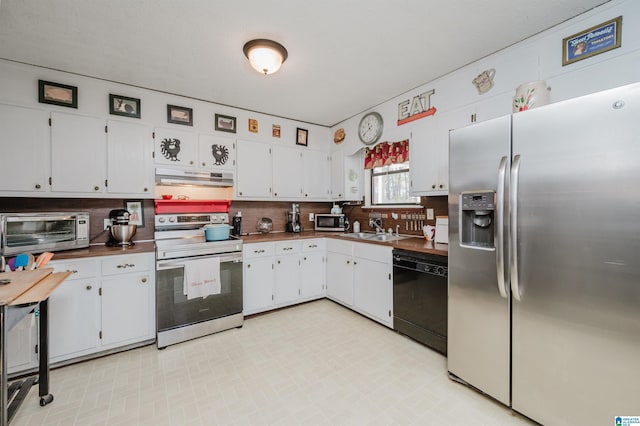 kitchen with white cabinetry, sink, and stainless steel appliances