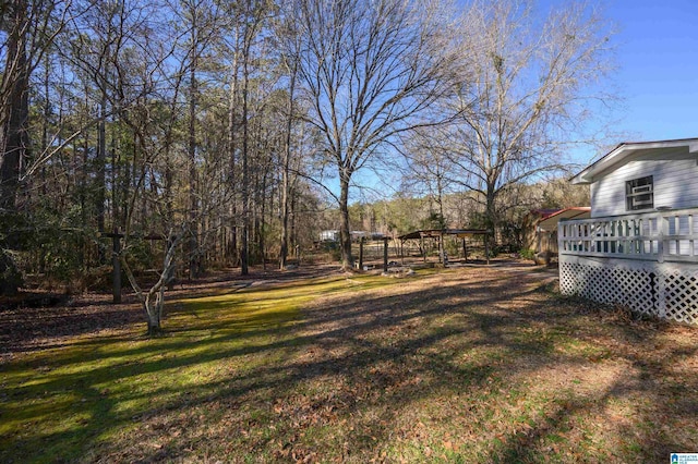 view of yard featuring a wooden deck