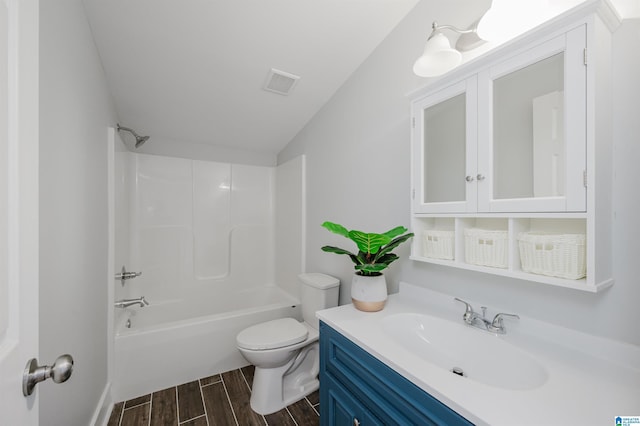 full bathroom featuring toilet, vanity, and shower / washtub combination