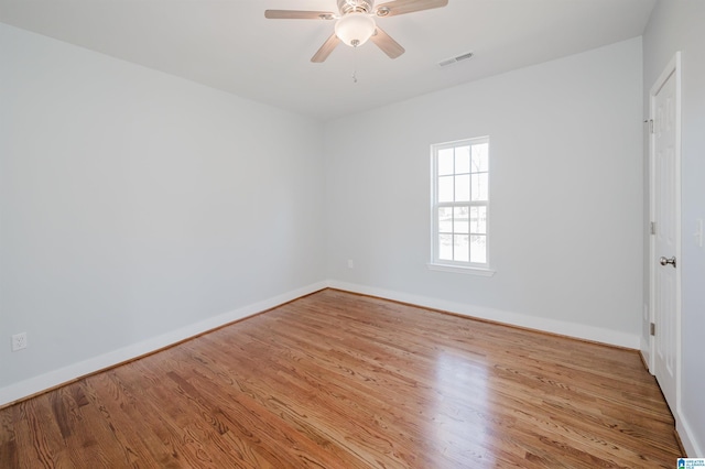 unfurnished room featuring light hardwood / wood-style flooring and ceiling fan