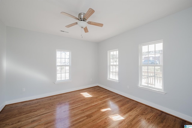 unfurnished room featuring hardwood / wood-style flooring and ceiling fan