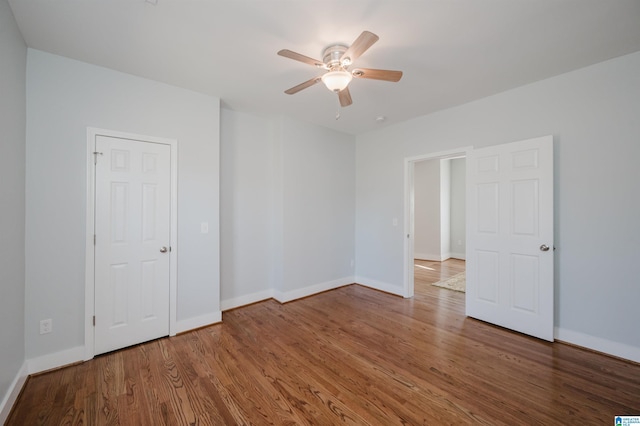 unfurnished bedroom featuring ceiling fan and wood-type flooring