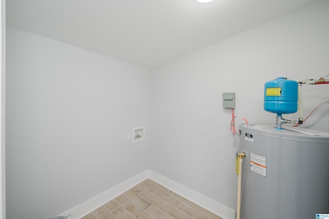 laundry room featuring washer hookup and water heater