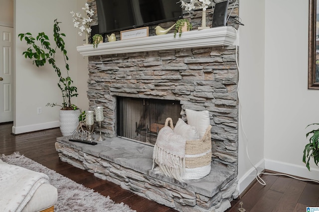 room details with a fireplace and hardwood / wood-style floors