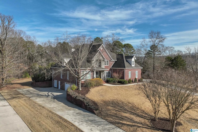 view of front facade with a garage and a front yard