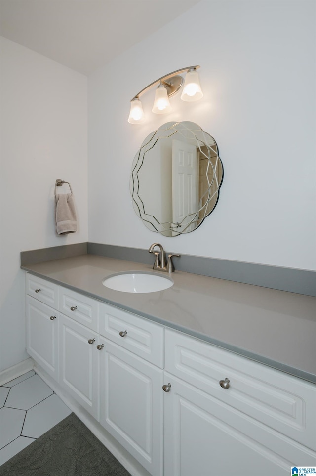 bathroom with tile patterned floors and vanity