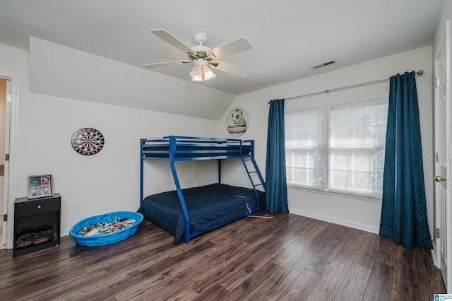 bedroom featuring lofted ceiling, dark wood-type flooring, and ceiling fan