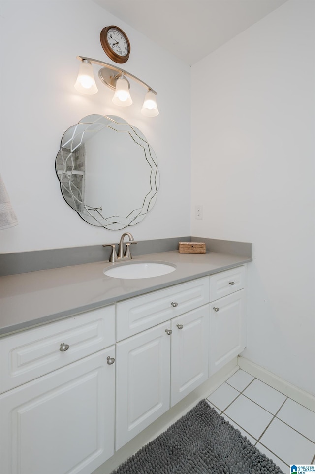 bathroom with tile patterned flooring and vanity