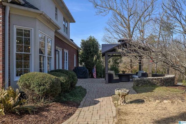 view of yard featuring a gazebo and a patio